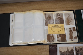 Three postcard albums containing a collection of Edwardian and later postcards, including some London scenes, London zoo, as well as other topographical scenes from Leigh-on-Sea, Whitby, Canterbury, Clacton, etc., plus s